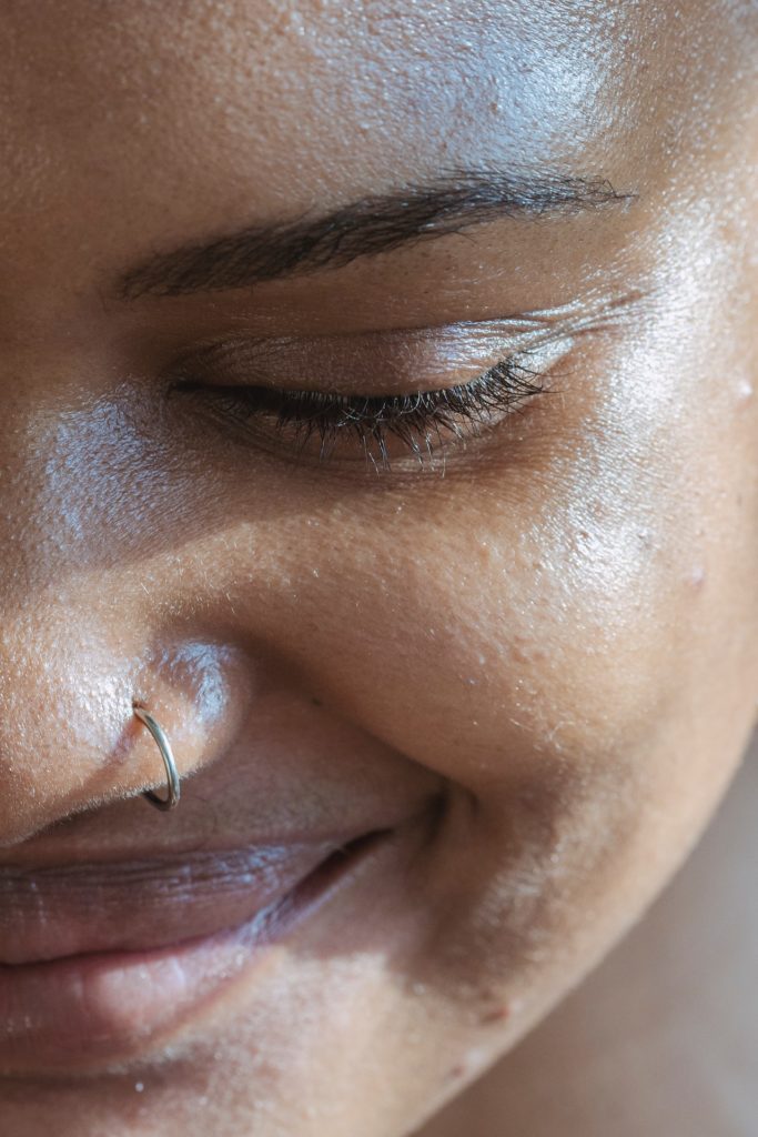 up close of womans face looking down