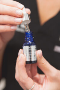 A woman prepares a chemical peel for a sun damage treatment OKC