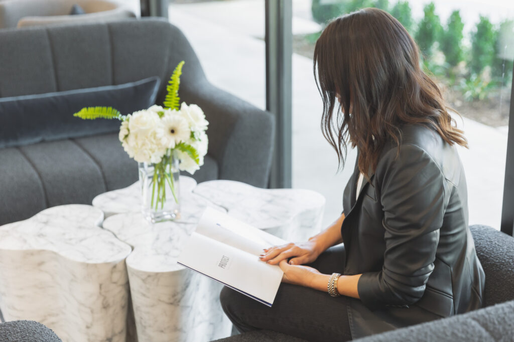 woman reading at table