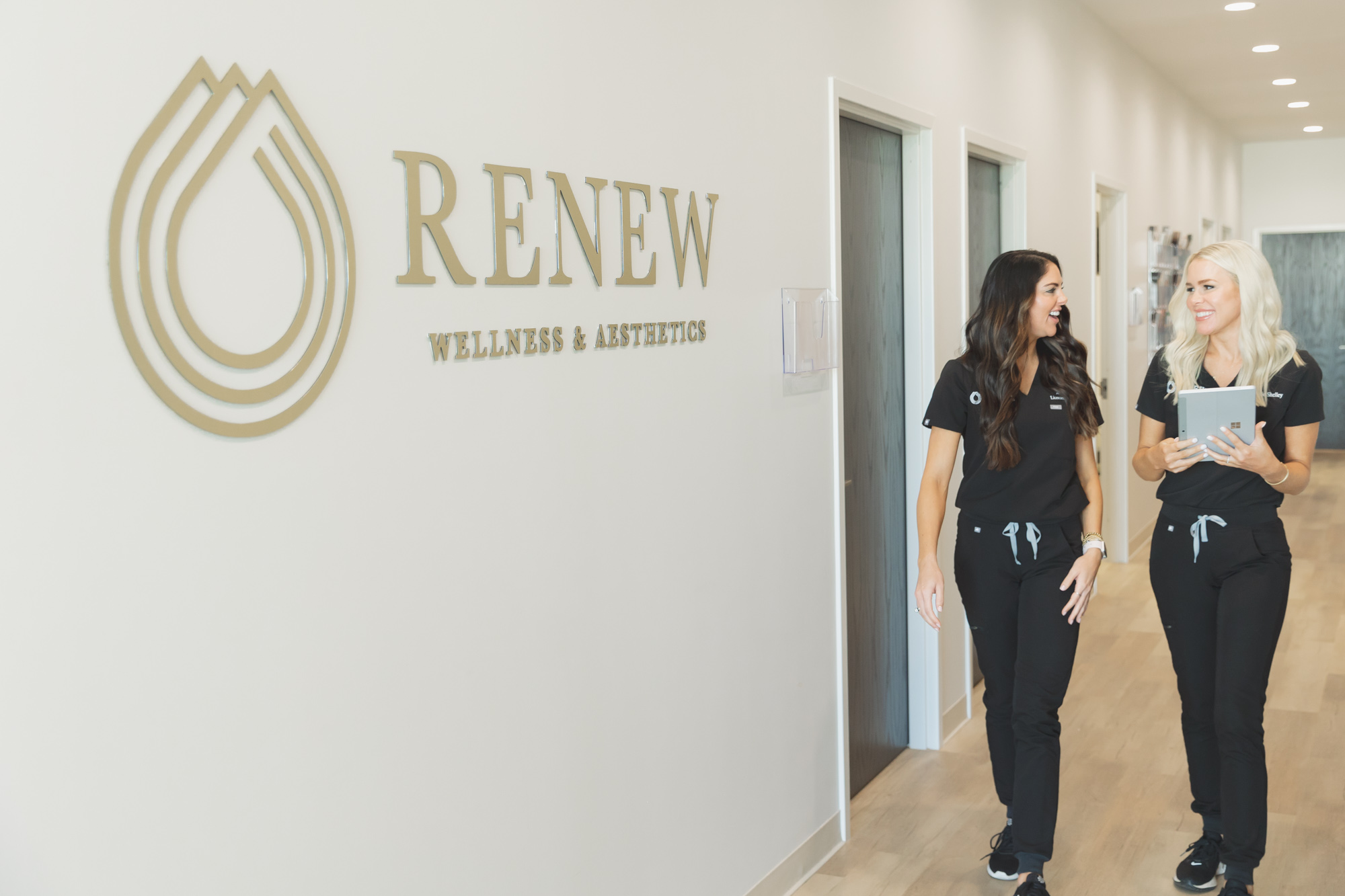 two women walking down the hallway