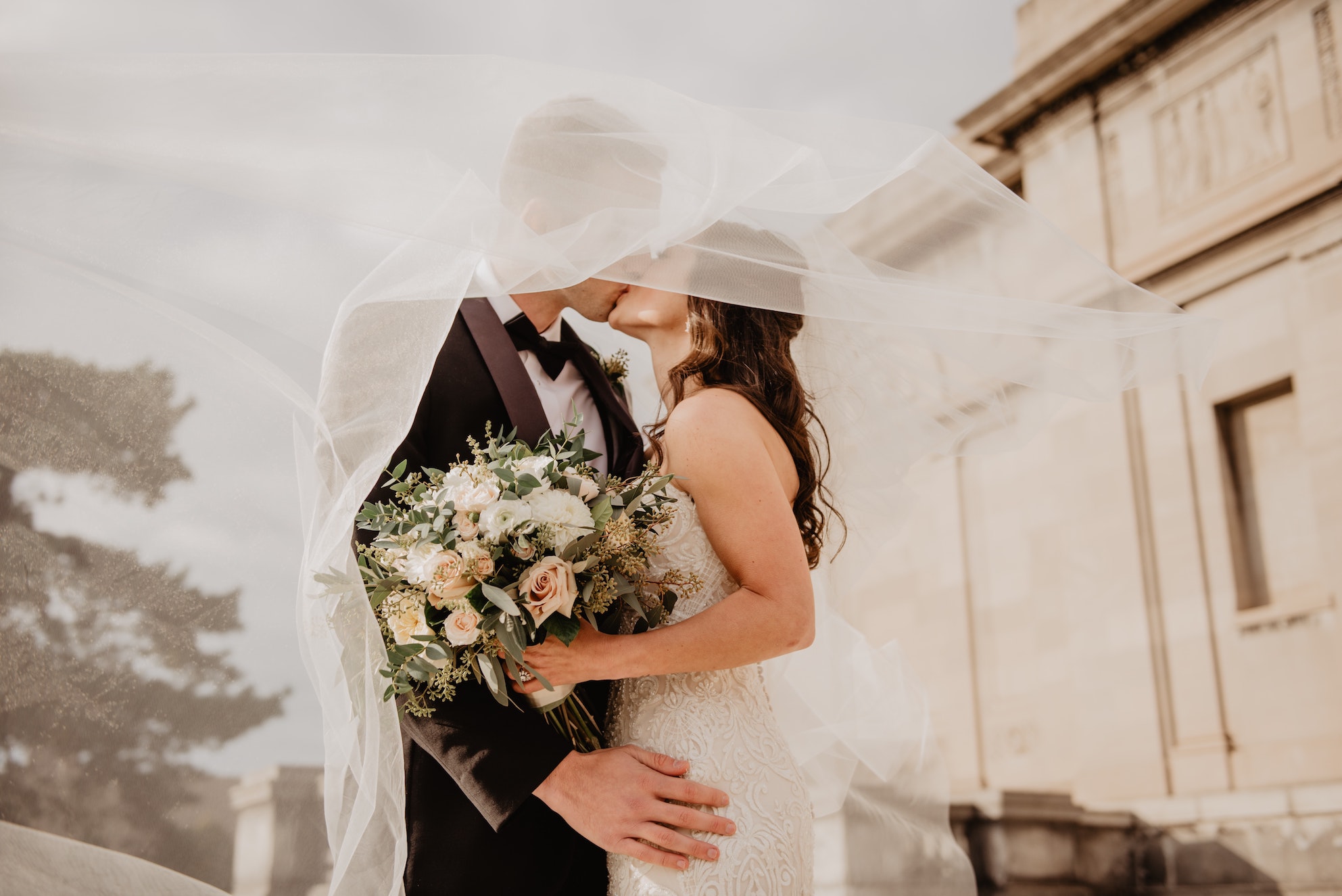 couple embracing in wedding photos