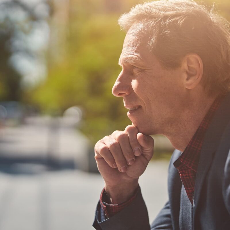 An older man contemplating if he needs Hormone Replacement Therapy for Men in Oklahoma City